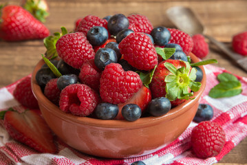 Fresh fruit salad on wooden table