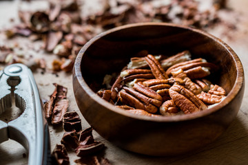 Peeled Pecan Nuts in Wooden Bowl without Shell / Walnuts.