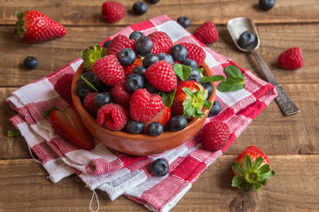Fresh fruit salad on wooden table
