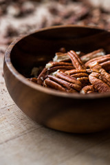 Peeled Pecan Nuts in Wooden Bowl without Shell / Walnuts.