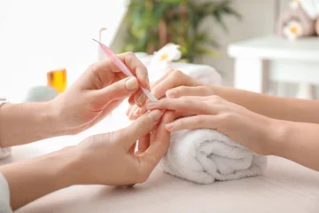  Young woman getting beautiful manicure in salon © Pixel-Shot