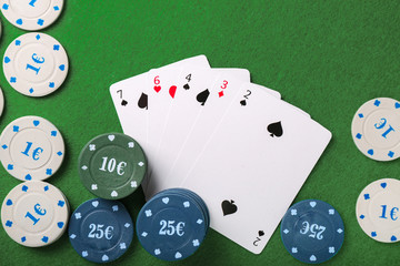 Chips and cards on table in casino