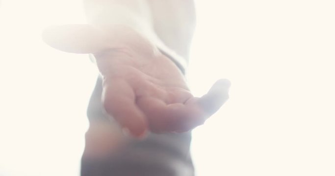 Angelic person appears with open hand reaching out for you to join in the afterlife.