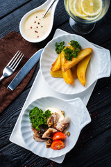 Herring snack with walnuts and cinnamon, garnished with baked potatoes.