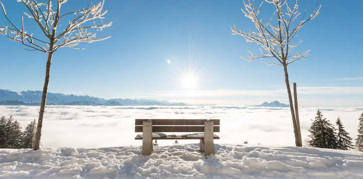 Bench In The Snowdrifts. Clouds Below Under The Feet. Rigi. Switzerland.