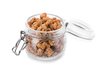 Jar with tasty granola on white background