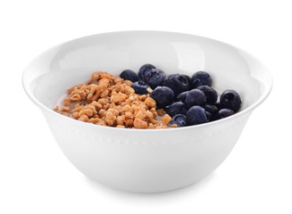 Bowl with tasty granola and yogurt on white background