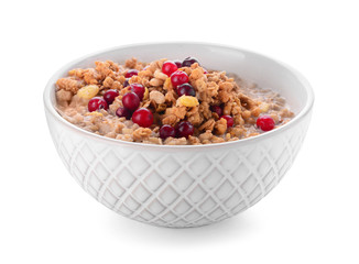 Bowl with tasty granola and yogurt on white background