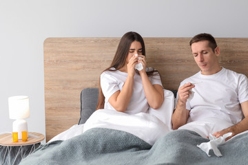 Obraz na płótnie Canvas Couple ill with flu at home