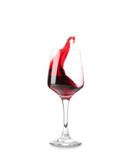 Glass with red splashing wine on white background
