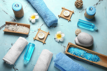 Composition with spa accessories and cosmetics on color background