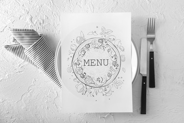 Menu on served table in restaurant