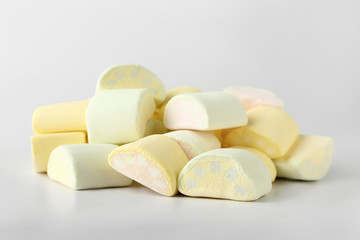 Tasty marshmallows on light background