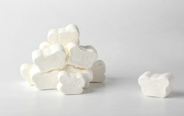 Tasty marshmallows on light background