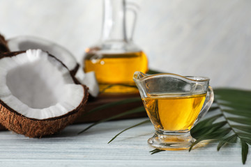 Gravy boat with coconut oil on table