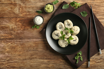 Composition with tasty Chinese dumplings on table