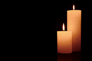Beautiful burning candles on dark background