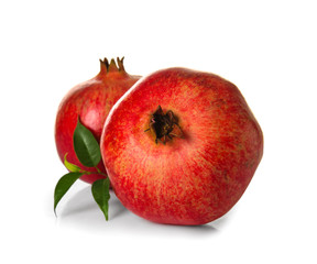 Ripe pomegranates on white background