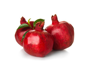 Ripe pomegranates on white background