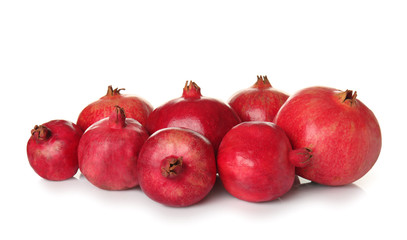 Ripe pomegranates on white background