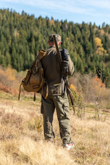 Hunter on hunting in the mountains, forestland