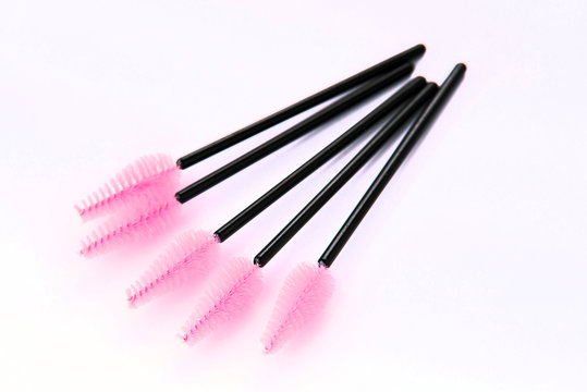 Brushes and tools for building and caring for eyelashes. On a white background. Materials for eyelash extension. Brushes, accessories for eyelash extensions.