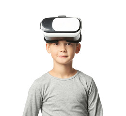 Cute boy with virtual reality glasses on white background