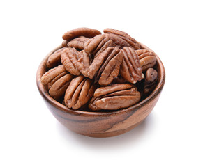 Bowl with pecan nuts on white background