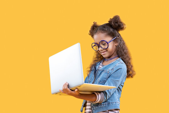 Cute Happy Girl Looking At The Computer Screen