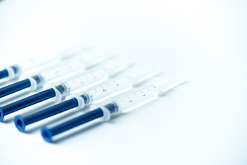 Obraz premium Syringe filled with liquid on a white background