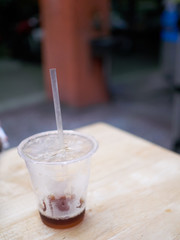 Street food at night - almost empty plastic cup