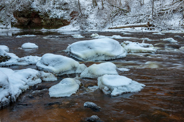 forest river in winter. Amata in Latvia