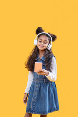 Cheerful nice girl enjoying the music rhythm