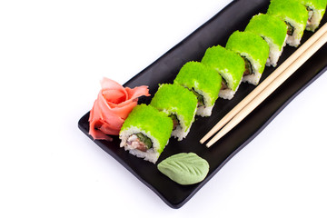 Sushi roll on black plate - traditional japanese food style