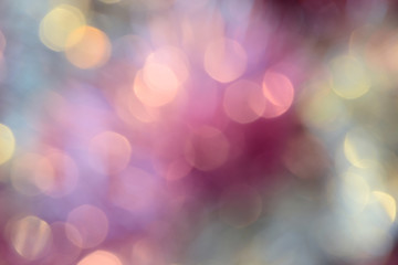 Bokeh photo. Holiday background. Christmas lights. Defocused sparkles. New Year backdrop. Festive...