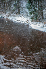 forest river in winter. Amata in Latvia