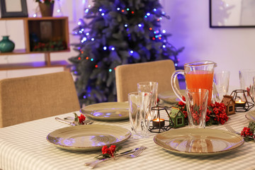 Festive table setting for Christmas dinner in room