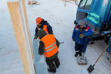 Workers on the installation of the ice town