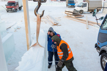 Workers on the installation of the ice town