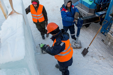 Workers on the installation of the ice town