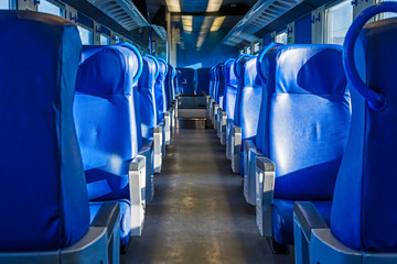 Fototapeta premium Train corridor with blue seats