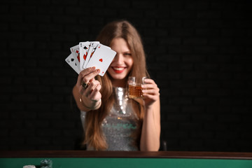 Female poker player at table in casino