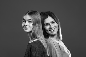 Black and white portrait of happy mother and daughter