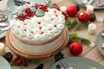 Tasty Christmas cake on festive table