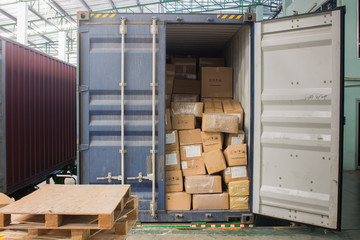 The cartons with loading out of container