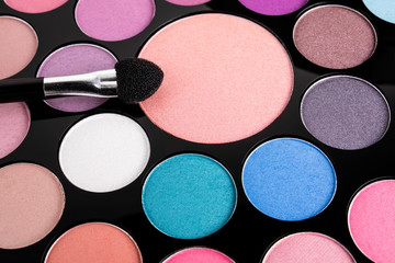 Palette of cosmetic eye shadow for make-up. Fashion and beauty background