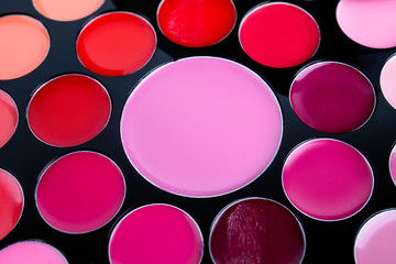 Palette of cosmetic eye shadow for make-up. Fashion and beauty background