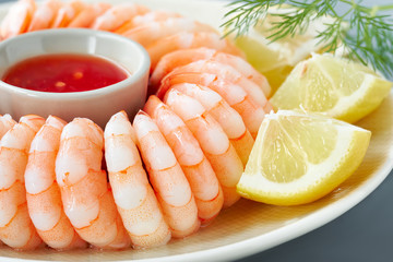 Close-up on shrimp ring with sweet chili sause