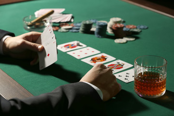 Male player at table in casino