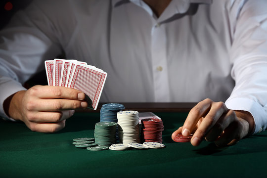 Male player at table in casino
